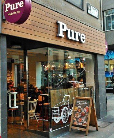Fachada comercial da Pure loja de produtos naturais